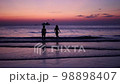 Happy kids silhouette at sunset sea horizon, joyfull children freedom concept 98898407