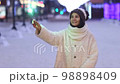 Portrait of young smiling Caucasian woman holding sparklers. Happy cheerful girl outdoors Celebrating New Year holidays vacation. Xmas Christmas winter atmosphere. 3840x2160 98898409