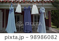 Bridesmaids evening dresses hanging on the house Bridesmaids evening dresses hanging on the house 98986082