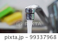 water flowing from the kitchen faucet 99337968