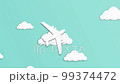 White paper airplane flying to the right on green background, stop motion. Top view. 99374472