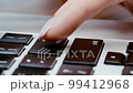 Slow motion, woman's finger pushing button enter on laptop keyboard, concept of e-commerce. Selling and buying items by internet. 99412968