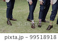 Men show their socks by lifting up their pants, close-up of legs Men show their socks by lifting up their pants, close-up of legs 99518918