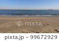 Sea, sandy beach and crashing waves 99672929