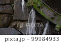 Water flowing down from the water wheel 99984933