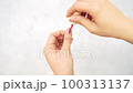 Body parts of Japanese women's hands doing self-nails 100313137