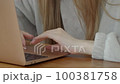 Pretty young woman surfing on the Internet, indoors 100381758