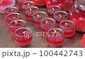 Red candles burning in a buddhist temple, Chengdu, Sichuan province, China 100442743