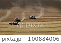 Harvester Harvests Wheat Crop On Field 100884006