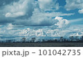 Time lapse of dramatic cumulus clouds in countryside over a field in autumn, winter or early spring 101042735