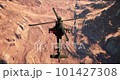 Helicopter AH-64D flying over the canyon 101427308