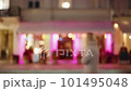 Bokeh city life, cityscape blurred background, urban street illuminated in evening. Bus public transport and people walking in slow motion. Downtown cityscape, illuminate colorful lights near cafe 101495048