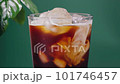 Pouring milk into iced cold brew coffee 101746457