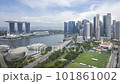 Time lapse of cloudscape scene aerial view at Marina Bay Singapore city skyline. Pan left 101861002