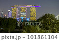 4k time lapse of sunset day to night scene at Marina Bay Singapore city skyline. Tilt up 101861104
