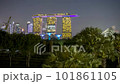 4k time lapse of sunset day to night scene at Marina Bay Singapore city skyline. Tilt down 101861105