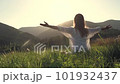 Woman in white clothes doing yoga in the beautiful mountains, sunrset 101932437
