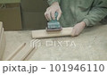 Manual labor for details in the manufacture of furniture. polishing wooden parts 101946110