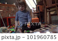A little boy is playing with toys in the room 101960785