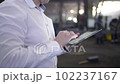 Engineer Is Using Tablet Pc In Factory. Slow-Motion. 102237167