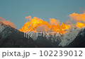 Glowing mountain illuminated by sunset sunlight. Beautiful Nature landscape background 102239012