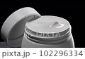 Jar with cream on big grey stone. 102296334