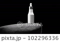 Bottle with pipet on big grey stone 102296336