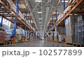 Products at the medium warehouse. Industrial interior storage room.  102577899