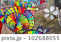 Close-up Of Colorful Pinwheel Spinning Outdoors 102688055