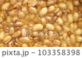 peeled peanuts in boiling oil. vegan and vegetarian food 103358398