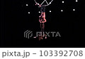 Aerial cube duo on black background perform risky trick. Concept of trust in relationship of couple  103392708