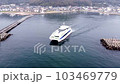 Aerial footage taken by a drone of a ferry sailing with whitecaps from Shikanoshima Port 4 103469779