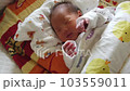 newborn sleeping in crib 103559011
