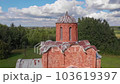The old Orthodox Church of the Savior on Kovalev, on the outskirts of Veliky Novgorod. The view from the drone on a sunny day. 103619397