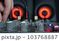 DJ Trendy girl plays music at night club party. Sound Designer Used Digital Audio Mixer In Production Studio. Spot light of multi-color neon. Funky dj mixing dance rhythm on mixer board. 103768887