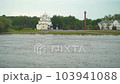 Church on the background of the river. A spring landscape of a swollen river, with a church in the background. 103941088