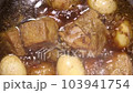 Boiling stewed chicken thigh with eggs and tofu, close-up shot 103941754
