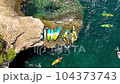 Kayaking. Sup. Aerial view of floating board and people on blue sea at sunny day. 104373743