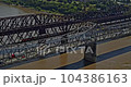 Memphis Tennessee Aerial v27 cinematic orbiting shot of trains running on frisco railroad bridge and vehicles passing on arkansas bridge - Shot with Inspire 2, X7 camera - August 2020 104386163
