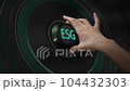ESG concept. The hand turns the toggle switch and turns on Environmental Social Governance. Idea illustration. 104432303