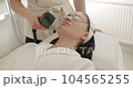 Facial rejuvenation, skin rejuvenation concept. Beautician cosmetologist doing procedure fractional microneedle mesotherapy rejuvenation with laser technology. Beauty treatment. 104565255