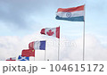 Flags of India, Canada, France, China, England, Scotland waving in wind blue sky background, closeup 104615172