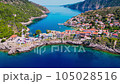 Assos, Greece. Aerial drone flight over picturesque village nestled on the idyllic Kefalonia, Greek Islands. 105028516
