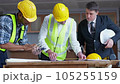 A team of engineers is discussing the structure to validate the building under construction. High quality 4k footage 105255159