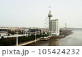 Lisbon, Portugal - February 2, 2023: Aerial view of the Vasco da Gama tower and skyscraper of the Myriad Hotel, the aerial tramway and the Vasco da Gama Bridge 105424232