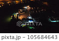 Loading from fishing ships to cargo trucks. Fishermen working under the lights of fishing ships in the harbor.Ideal for fishery industry, night work life.People workers mobility midnight port seaport 105684643