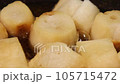A close-up of the cooking scene where the gluten (grilled gluten) is boiled in a frying pan containing the dashi stock to bind it with the egg. 105715472