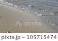 Gentle waves lapping at the sandy beach of the beautiful transparent sea. 105715474