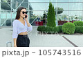 Two beautiful women met near the airport in the city 105743516