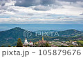 Time lapse of The landscape of Wat Phra That Pha Son Kaew with its five large white Buddha images is unique and features mountains, sky and rain clouds. 105879676
